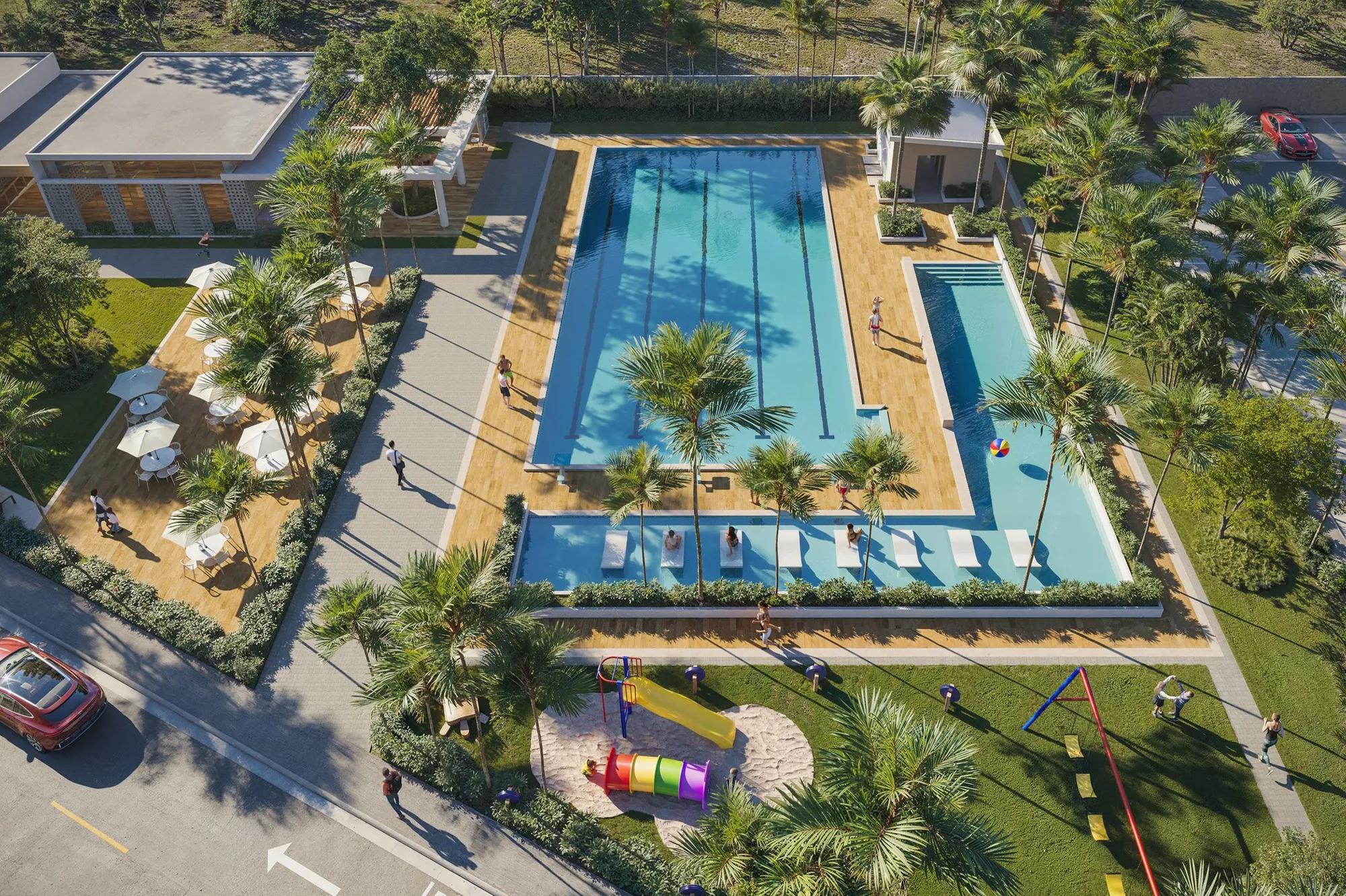 Vista aérea de la piscina semiolímpica de Brisas 6 rodeada de terraza, sombrillas y áreas verdes